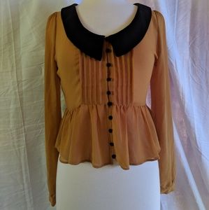 Yellow button down blouse.